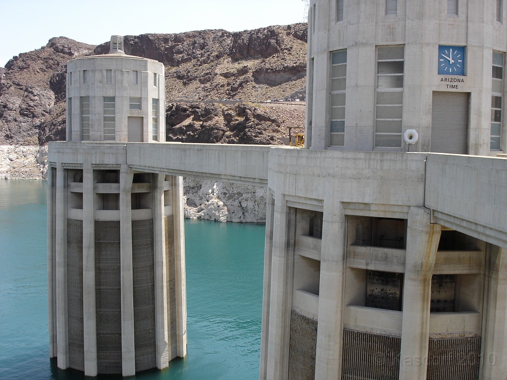Las Vegas 2010 - Hoover Dam Revisited 0326.jpg - A prolonged dry spell, lasting over a decade, is steadily draining the water sources that power Hoover Dam’s giant turbines and has left Lake Mead at only 41 percent full. The lake has dropped 130 feet since 1999 and is now at 1,084 feet, depths not seen since 1956. The Bureau of Reclamation projects it will shrink another two feet by next month, reaching its lowest elevation since the reservoir was filled in the 1930s.Dam bridge progress during the July 2, 2006 Las Vegas tour.2006 Photo!